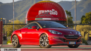 Peugeot RCZ R – front three-quarter, red against a track background
