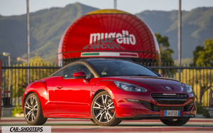 Peugeot RCZ R – front three-quarter, red against a circuit backdrop