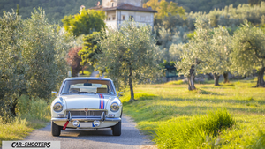 MG BGT Sesto Fiorentino Fullhd – front three-quarter, white on a rural road
