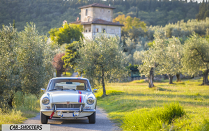 MG BGT Sesto Fiorentino Retina – front three-quarter, white on a country road