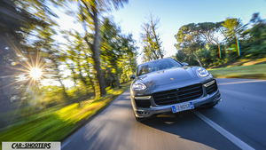 Porsche CAYENNE GTS – front three-quarter, grey metallic on a tree lined road