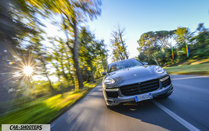 Porsche CAYENNE GTS – front three-quarter, grey metallic on a country road