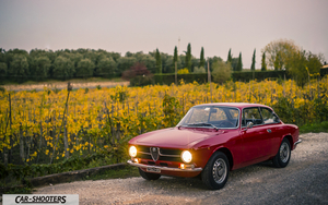 Alfa Romeo Giulia GT Junior 1300 – front three-quarter, red on a country road