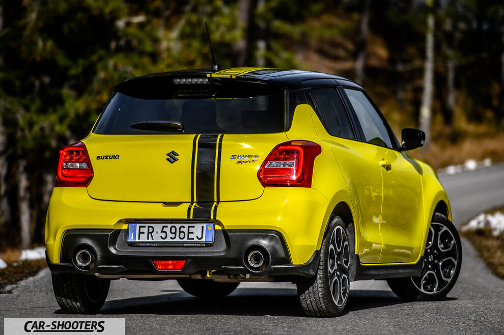 Suzuki Swift Sport – rear three-quarter, yellow on a country road