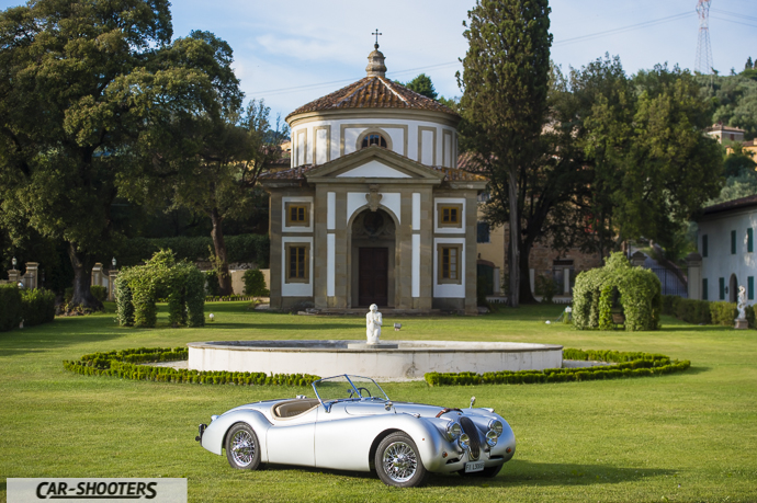 Jaguar XK 120 – front three-quarter, silver in front of a historic building