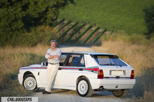 Lancia Delta HF Integrale Martini 5 – rear three-quarter, white against a countryside backdrop