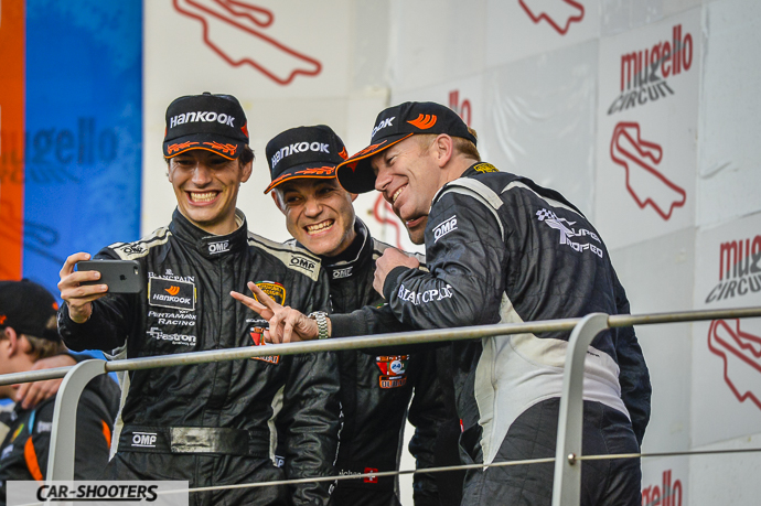 detail, racing drivers taking a selfie