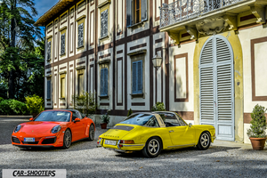 Porsche 911 Targa Storica – front three-quarter, orange in front of a historic building