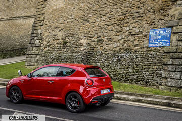 Alfa Romeo Mito Veloce Imola Mugello – rear three-quarter, red against a stone wall