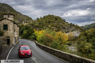 Alfa Romeo Mito Veloce Imola Mugello – front three-quarter, red on a country road