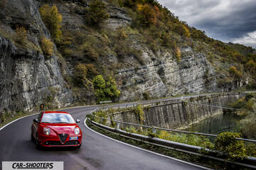 Alfa Romeo Mito Veloce Imola Mugello – front three-quarter, red on a winding mountain road