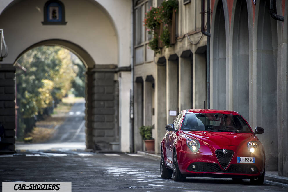 Alfa Romeo Mito Veloce Imola Mugello – front three-quarter, red in an old european street