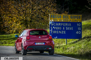 Alfa Romeo Mito Veloce Imola Mugello – rear three-quarter, red on a country road next to a road sign