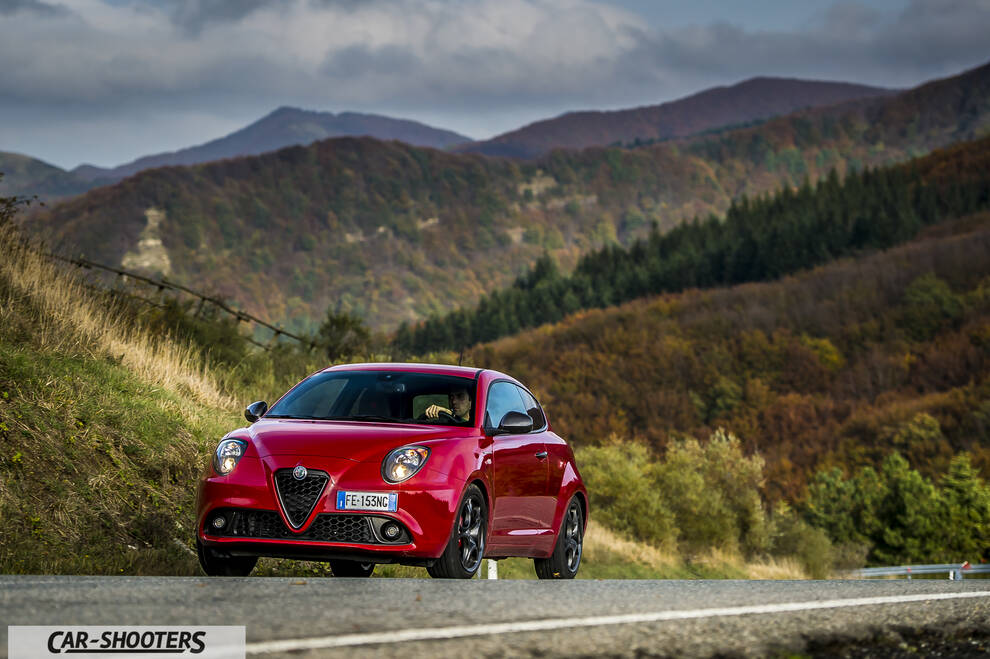 Alfa Romeo Mito Veloce Imola Mugello – front three-quarter, red against a mountain backdrop