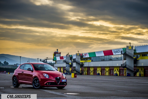 Alfa Romeo Mito Veloce Imola Mugello – front three-quarter, red at a racetrack