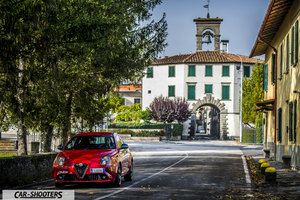 Alfa Romeo Mito Veloce Imola Mugello – front three-quarter, red on a european village street