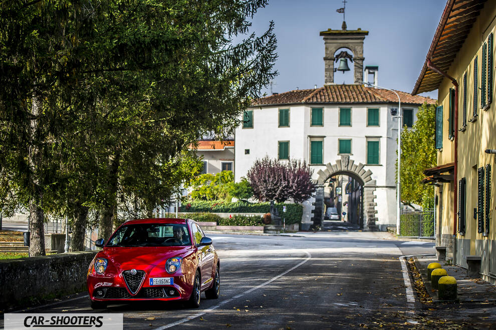 Alfa Romeo Mito Veloce Imola Mugello – front three-quarter, red on a european village street