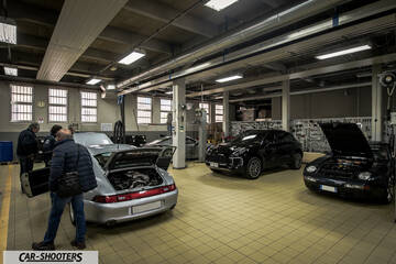 Porsche – rear three-quarter, silver in a garage workshop