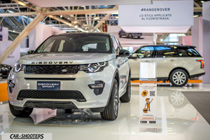 front three-quarter, silver at an indoor auto show