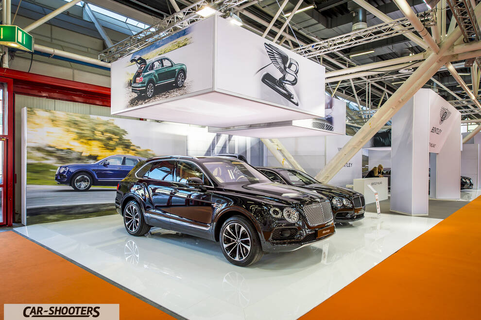 front three-quarter, dark brown on an auto show stand