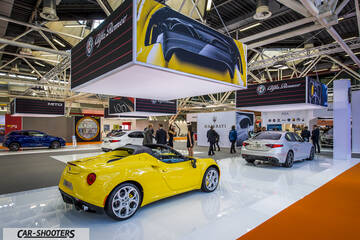 rear three-quarter, yellow at an indoor auto show