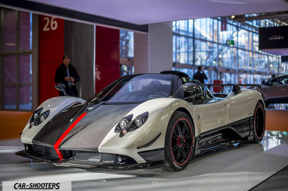 front three-quarter, off-white in an auto show exhibit