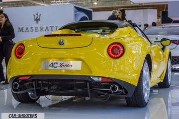 rear three-quarter, yellow at an auto show