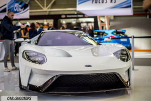 front three-quarter, white at an indoor auto show
