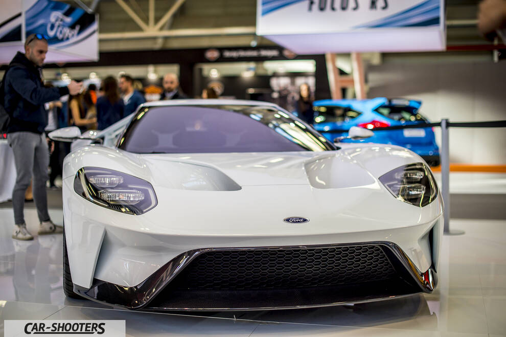 front three-quarter, white at an indoor auto show