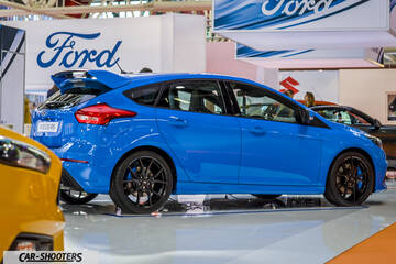 side profile, blue at a car show