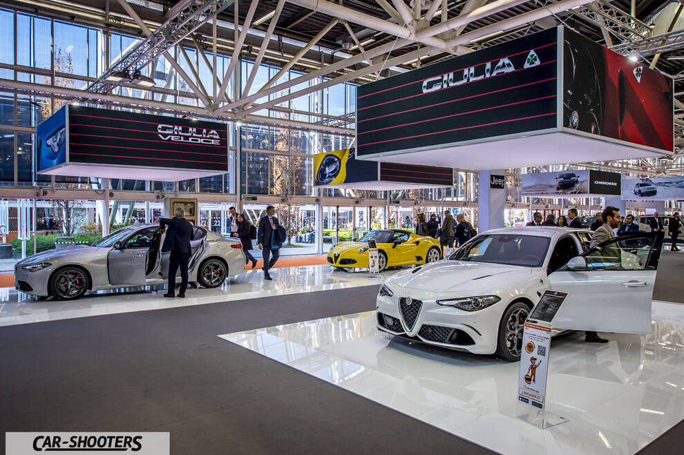 front three-quarter, white at an indoor car exhibition
