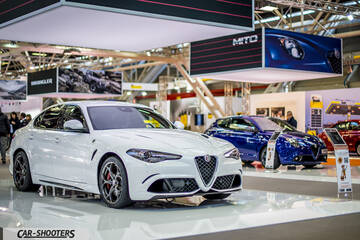 front three-quarter, white at a car exhibition