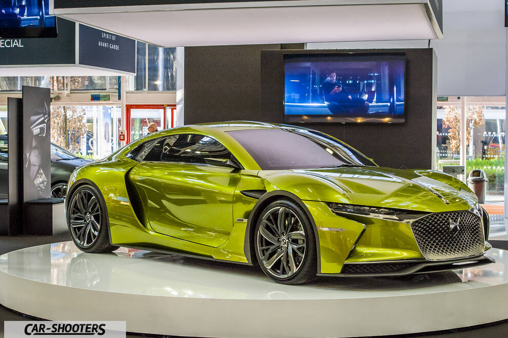 front three-quarter, yellow-green on a rotating display platform