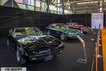 front three-quarter, black at an indoor car exhibition