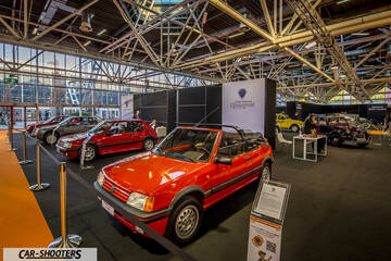 front three-quarter, red at an indoor car exhibition
