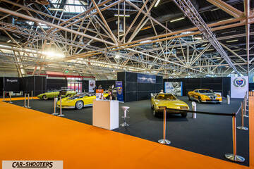 front three-quarter, at an indoor auto exhibition