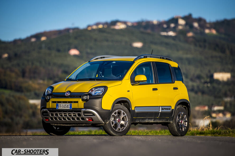 Fiat Panda 4X4 Cross – front three-quarter, yellow against a mountain backdrop
