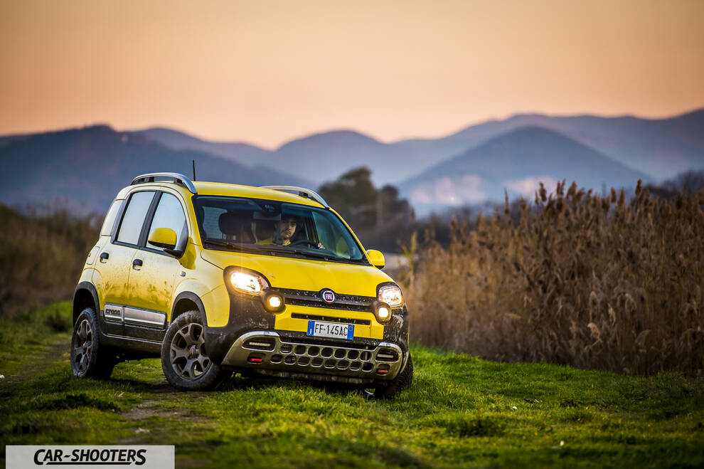 Fiat Panda 4X4 Cross – front three-quarter, yellow against a mountain backdrop