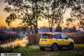 Fiat Panda 4X4 Cross – rear three-quarter, yellow parked near water at sunset