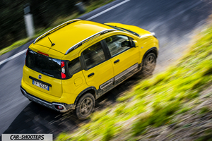 Fiat Panda 4X4 Cross – rear three-quarter, yellow on a country road