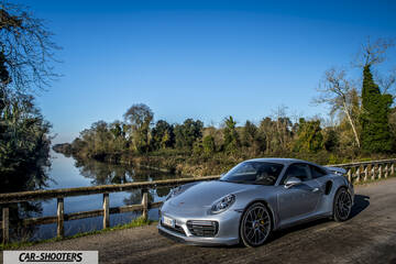 Porsche 911 Turbo S – front three-quarter, silver metallic on a country road