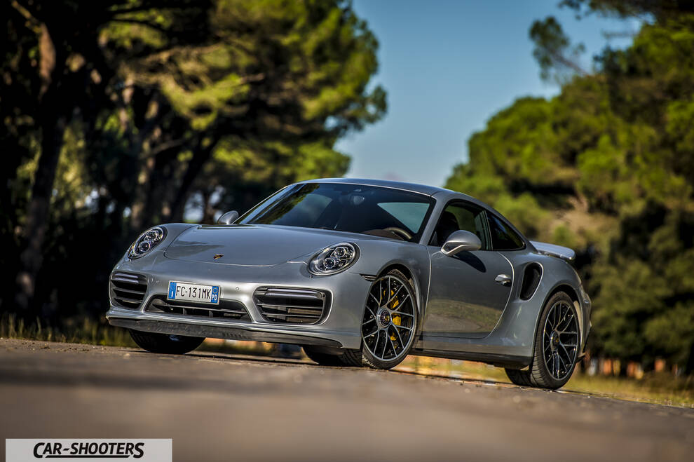 Porsche 911 Turbo S – front three-quarter, silver metallic on a country road