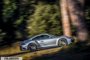 Porsche 911 Turbo S – side profile, silver on a country road