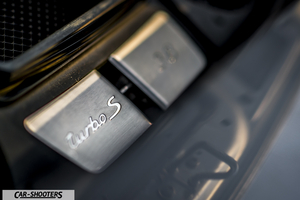 Porsche 911 Turbo S – engine bay, brushed metal badging close-up