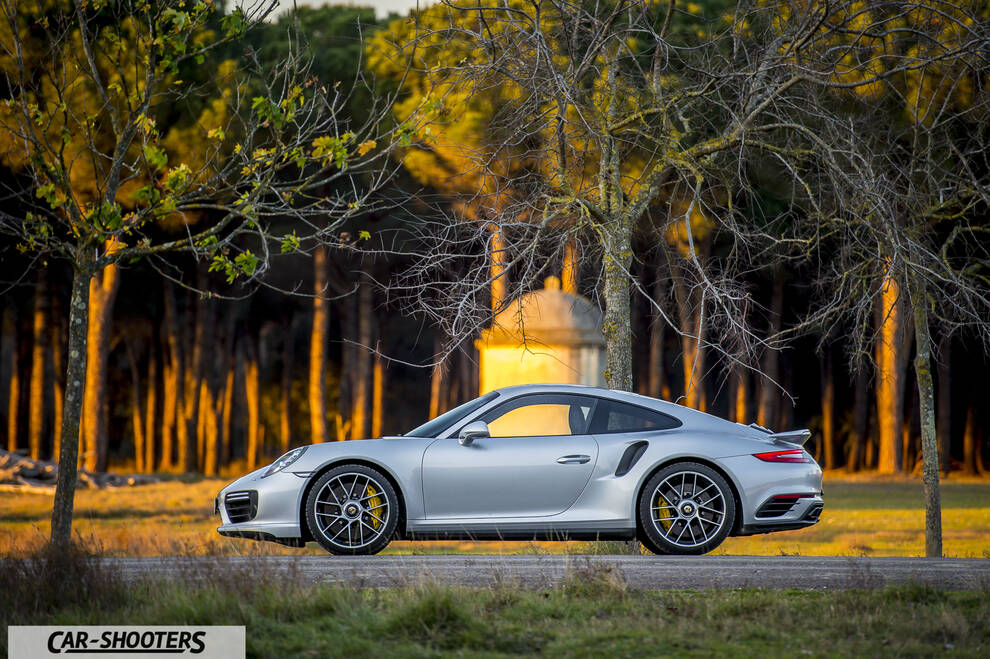 Porsche 911 Turbo S – side profile, silver on a country road