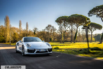 Porsche 911 Turbo S – front three-quarter, silver on a country road