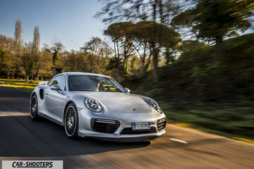 Porsche 911 Turbo S – front three-quarter, silver on a country road