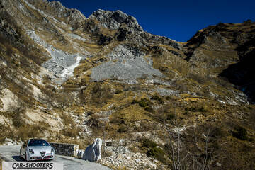 Alfa Romeo Giulietta Veloce – front three-quarter, silver against a mountain backdrop