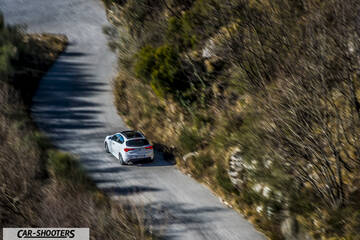 Alfa Romeo Giulietta Veloce – rear three-quarter, white on a winding mountain road