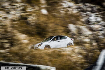 Alfa Romeo Giulietta Veloce – side profile, white on a mountain road